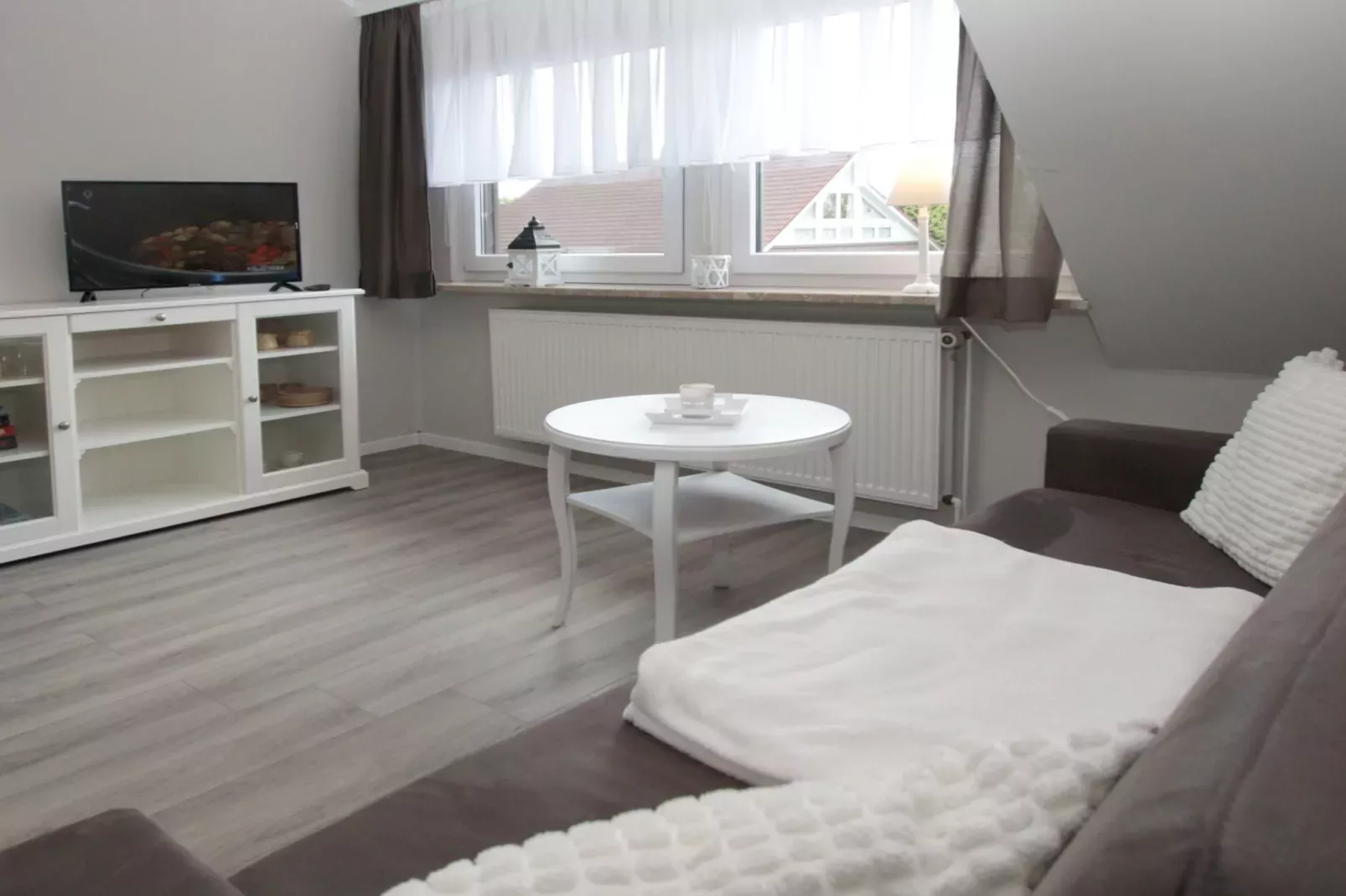Ferienwohnung in Berumbur-Woonkamer