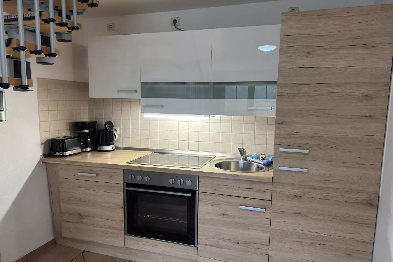 Bernstein mit Balkon am Sandstrand-Keuken