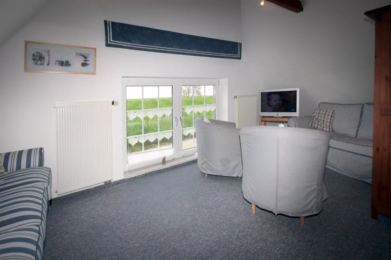 Ferienwohnung in Hilgenriedersiel-Woonkamer