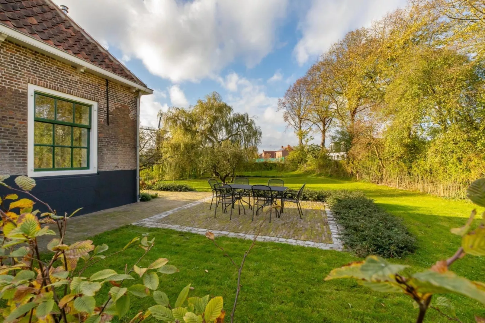 Vakantiehuis 'Boerderij Molenhof' - Stationsweg 5  Heinkenszand-Tuinen zomer