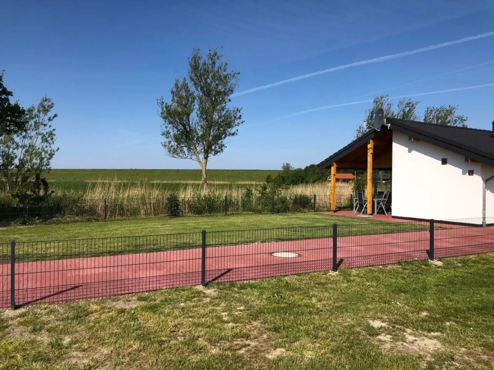 K18 Ferienhaus mit Wiesenblick in Eckwarderhörne-Buiten