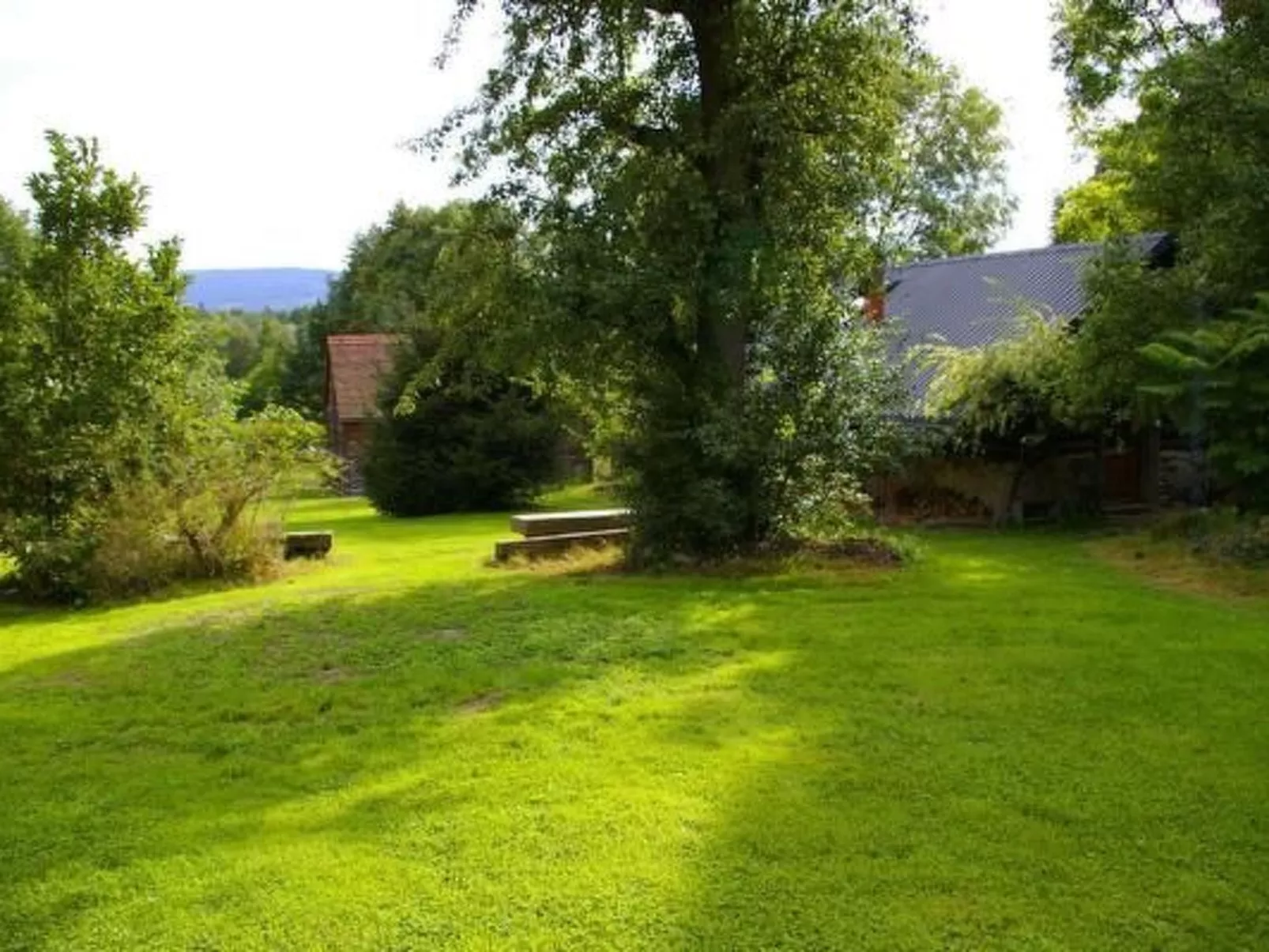 Blockhaus in Gajówka mit Kaminofen-Buiten