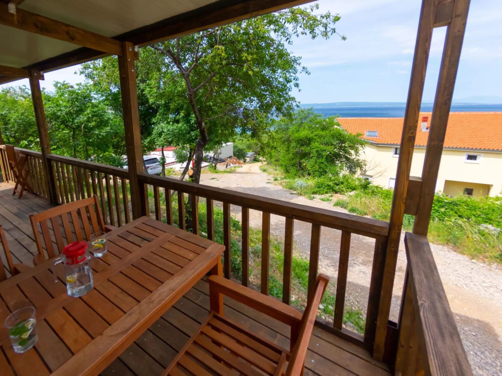 Mobilheim mit gemeinschaftlichem Pool-Buiten