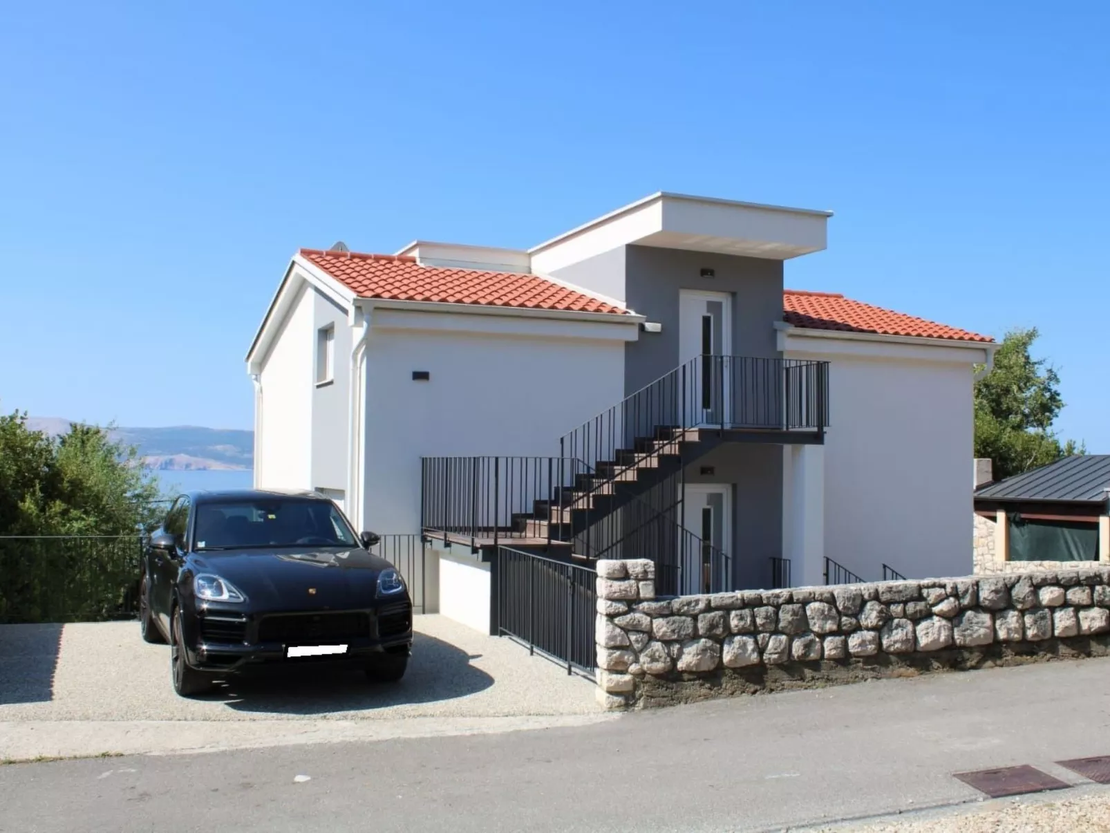 Appartement mit Terrasse, Meerblick, Jacuzzi, Außenpool-Buiten