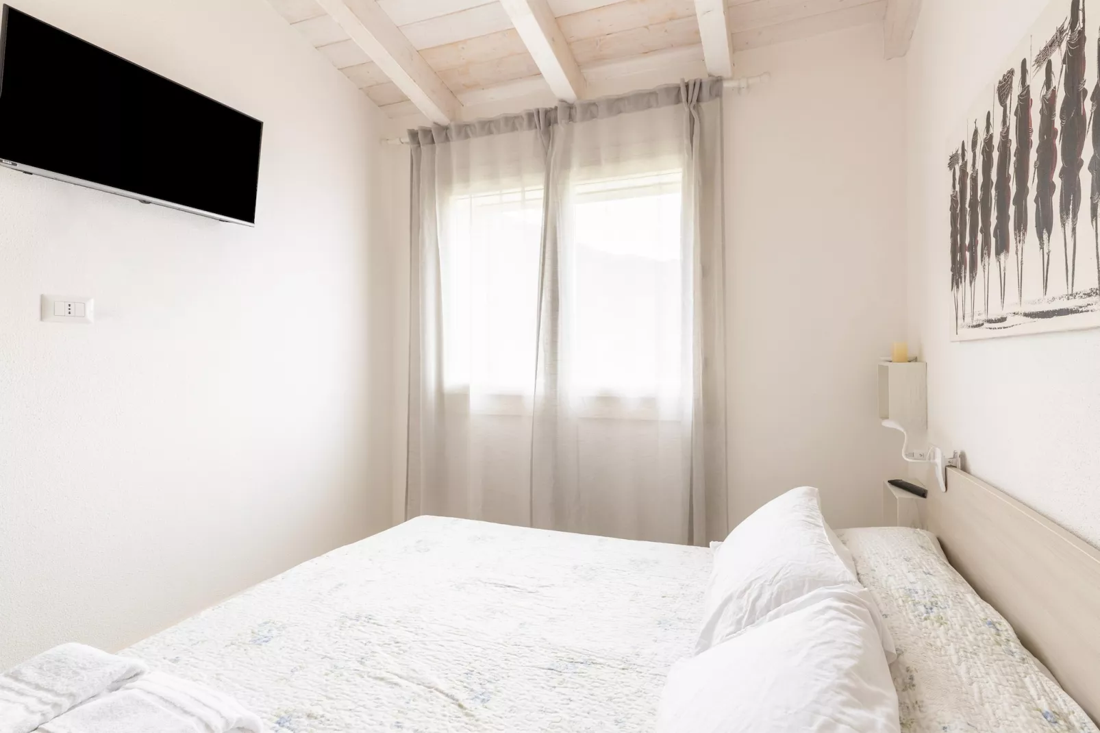 ATTICO BADESI CON PISCINA - Slaapkamer