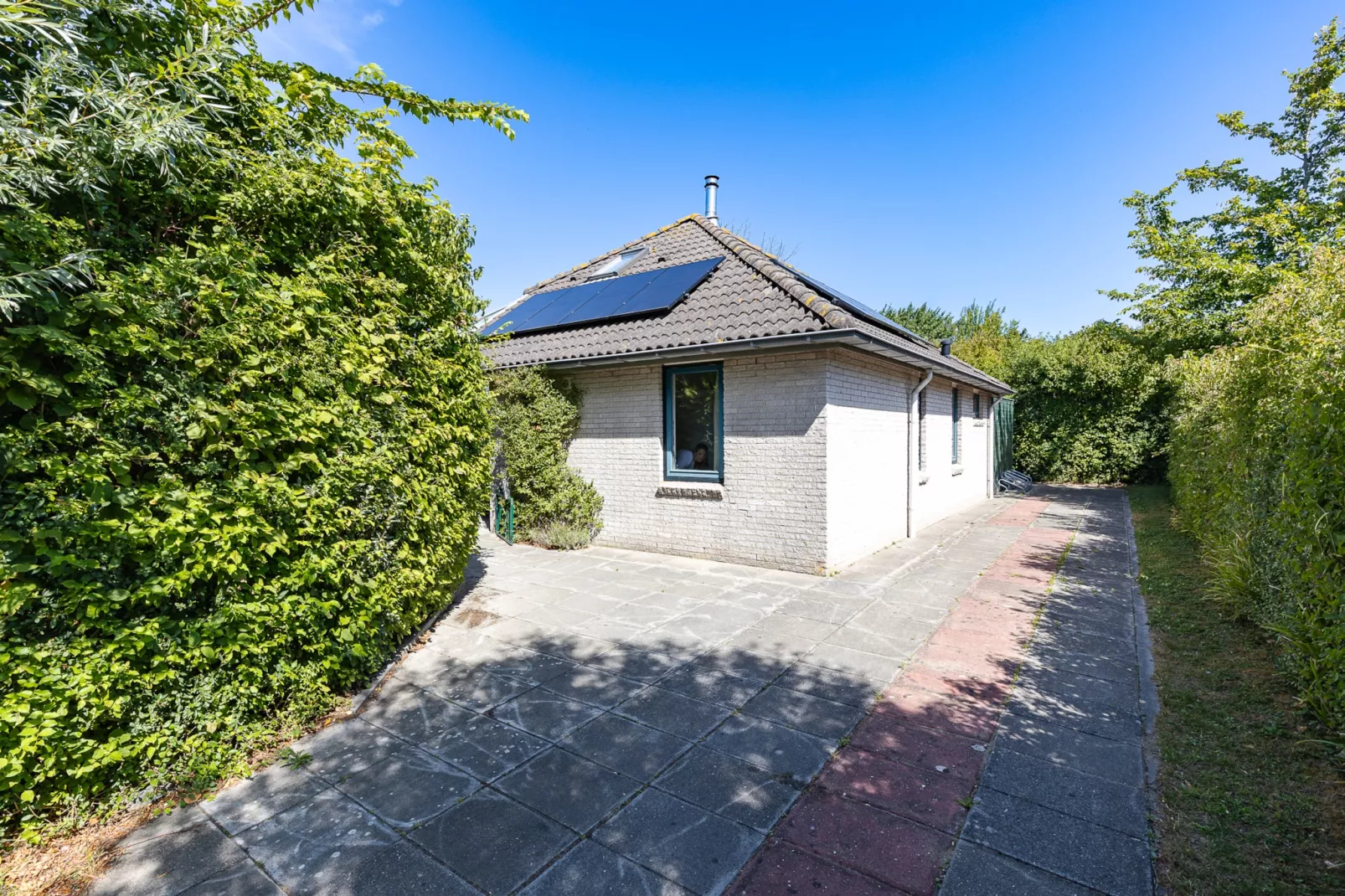 Vakantiewoning - Westduin 6 I Vlissingen 'Zilt en zand' - Tuinen zomer