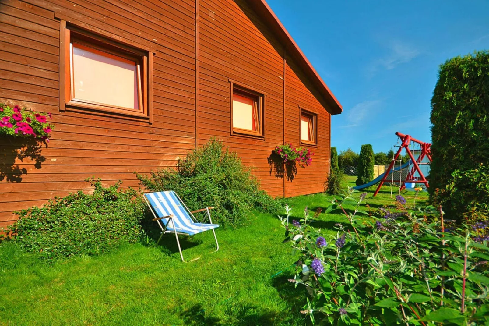 Domki wakacyjne Wicie - Tuinen zomer