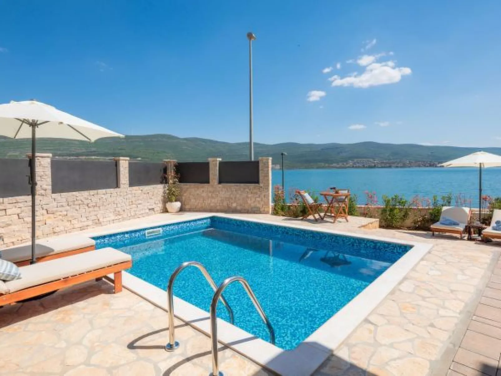 Beachfront villa Noa with heated pool