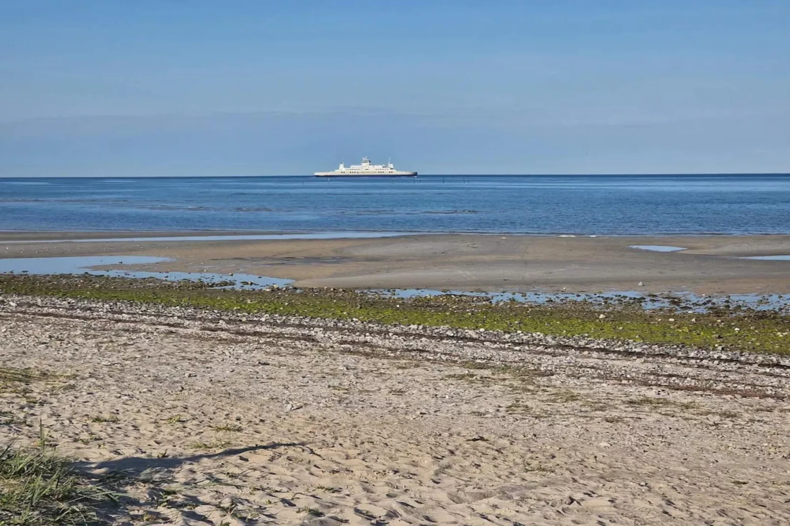 Vakantiehuis aan de kust met spa en sauna - Waterzicht
