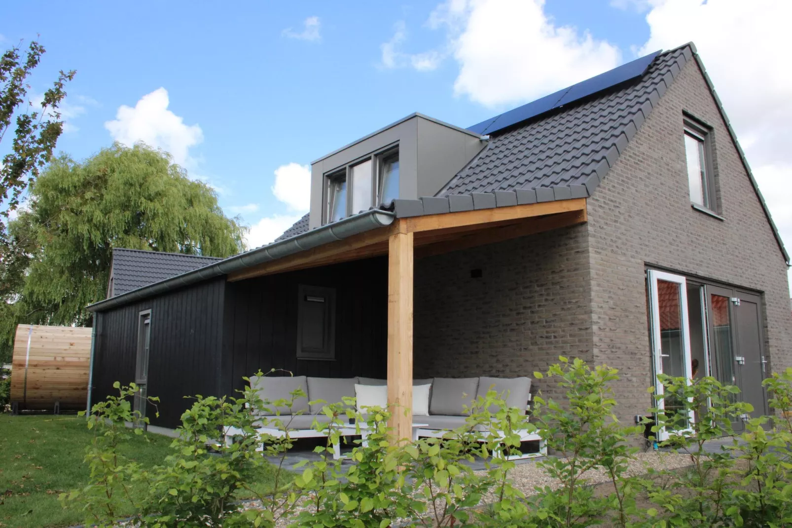 Vakantiehuis Ultiem Genieten - 80 - Buitenkant zomer