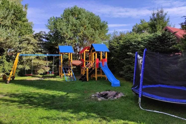 Całoroczny dom wakacyjny w Kopalinie - Tuinen zomer