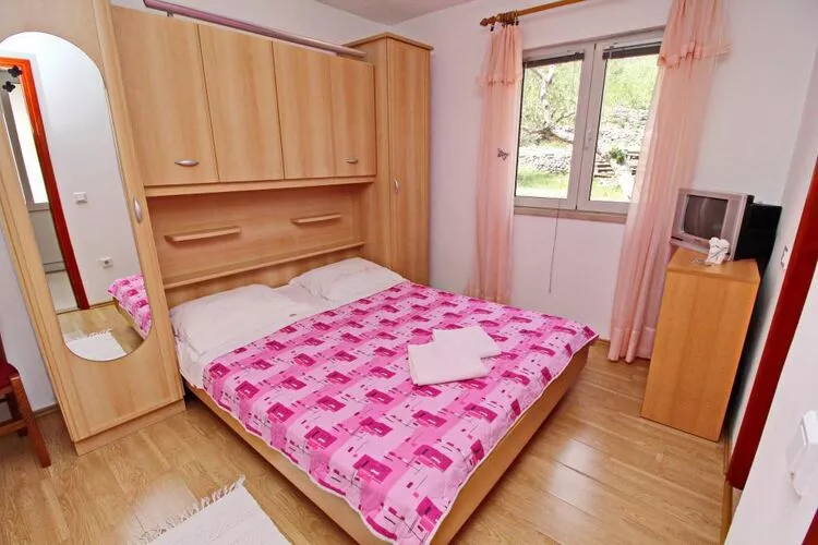 Apartments Radojković Lumbarda -One Bedroom Apartment with Terrace and Partial Sea View(A1)-Slaapkamer