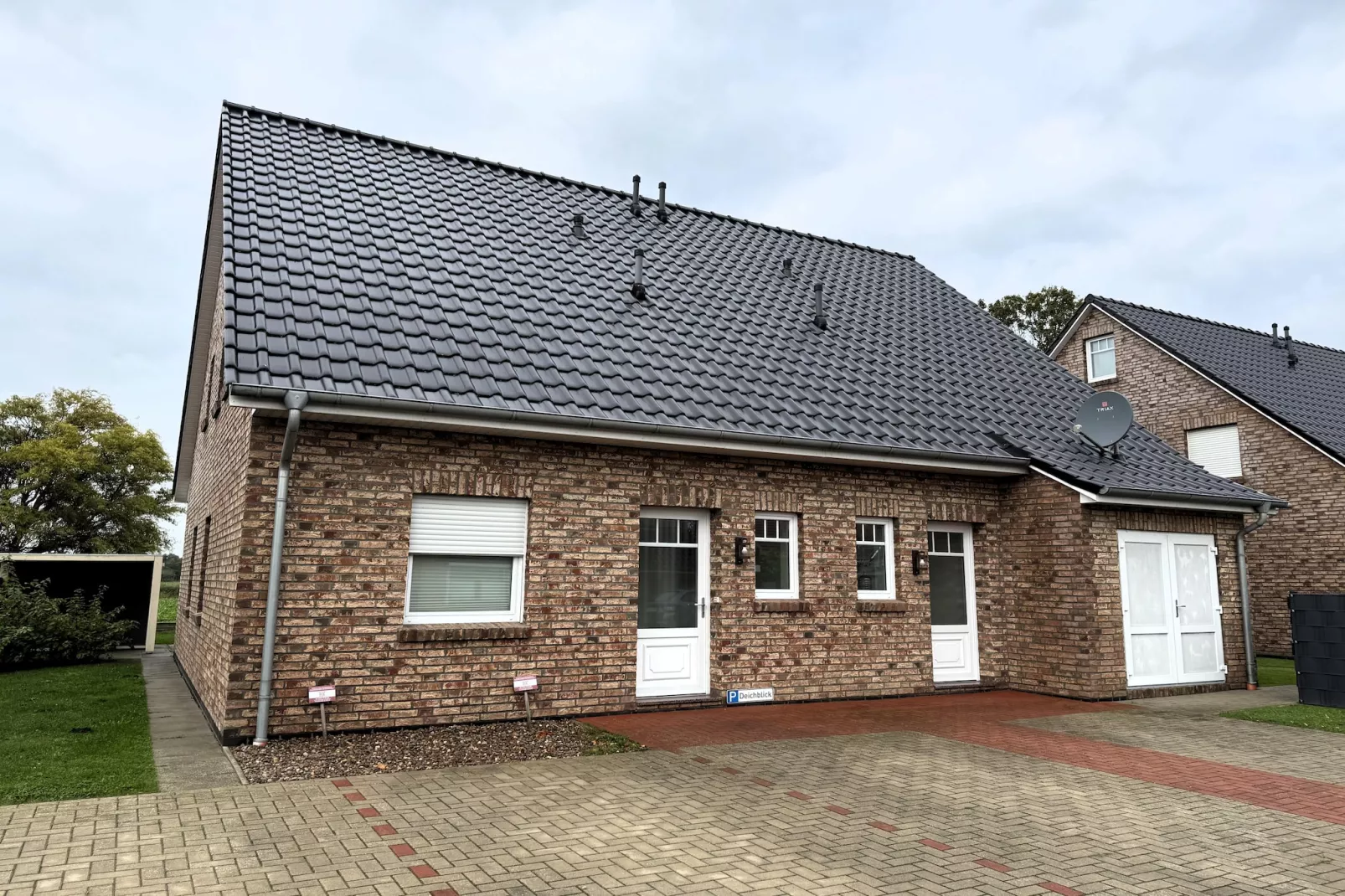 Gemütliche Nordsee-Wohnung in Neßmersiel mit Garten und Feldblick-Buitenkant zomer