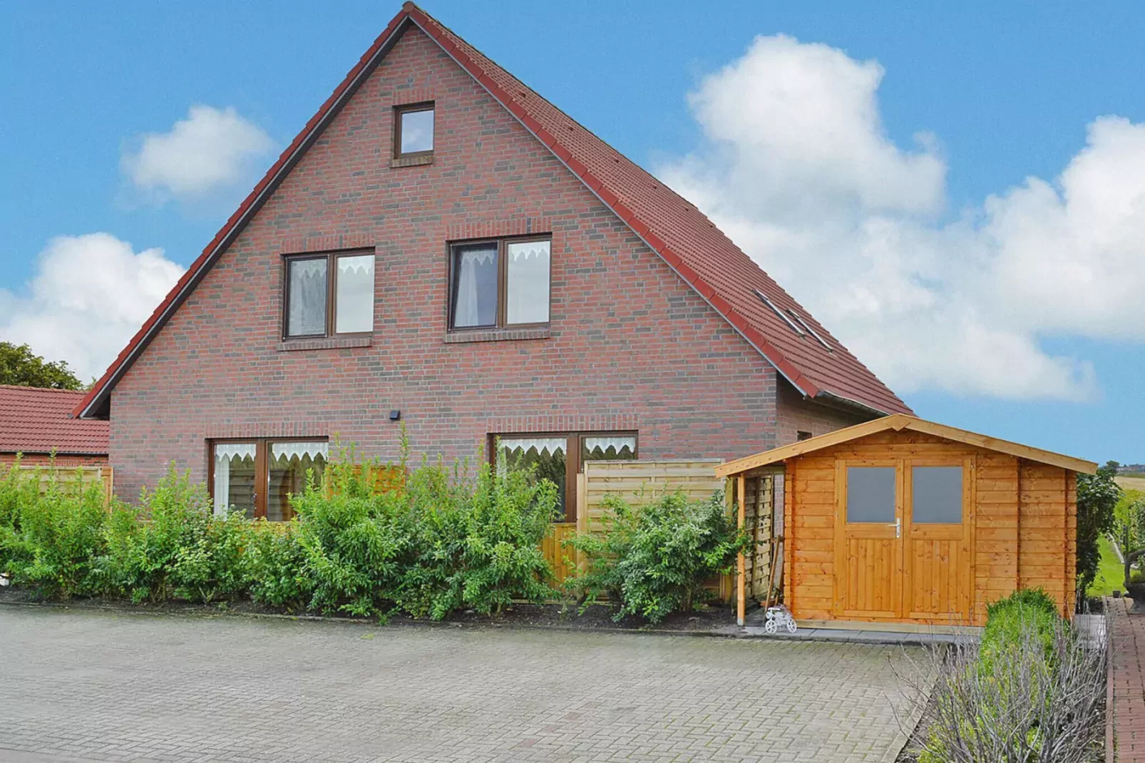 Fewo Wattkieker - Wattseite-Buitenkant zomer